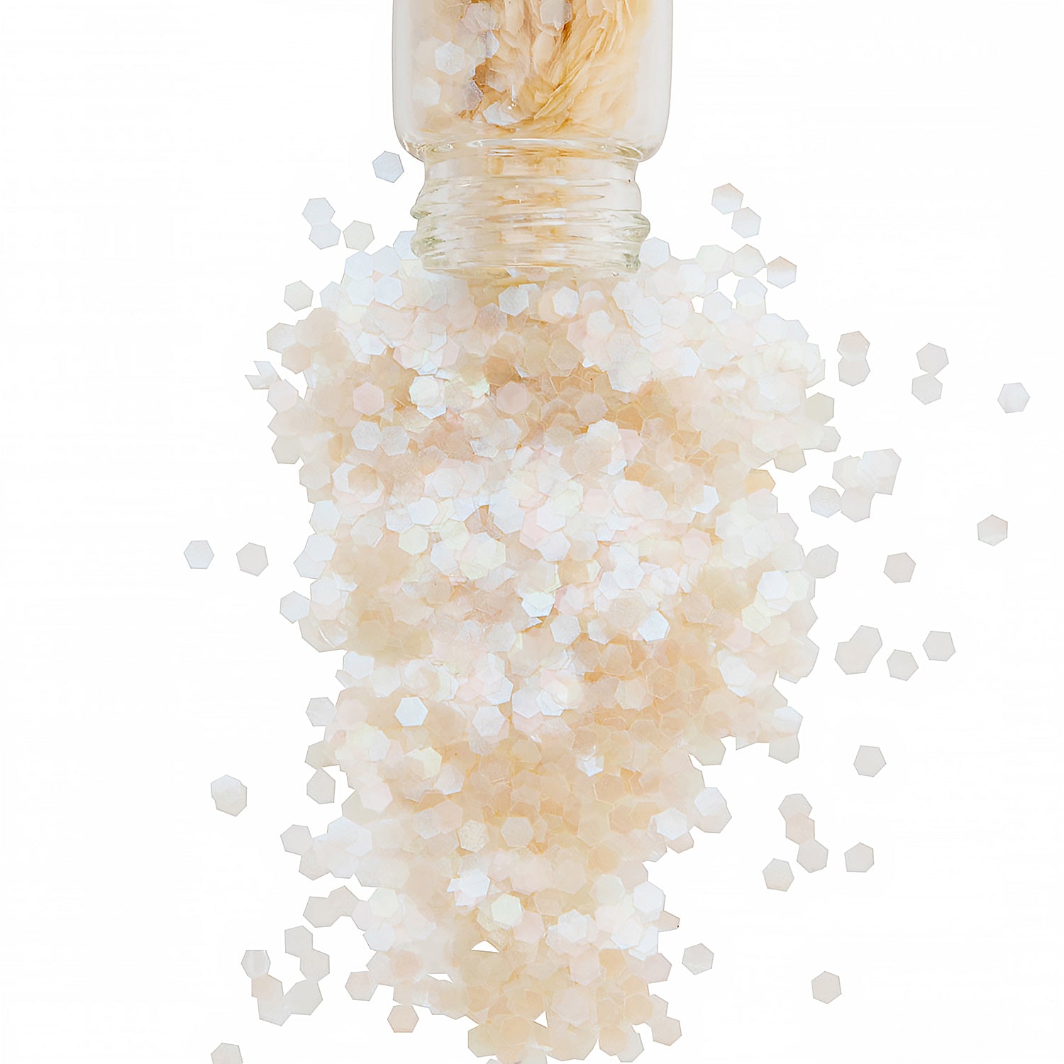 Opal bioglitter in a glass jar spilling out onto a white back ground
