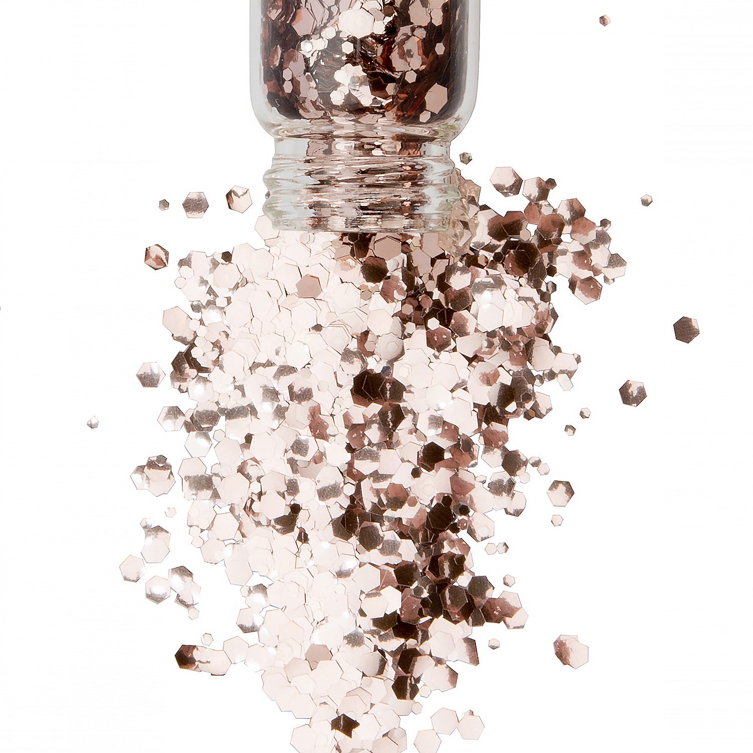 Chunky rose gold bio glitter in a glass jar spilling out all over a white background,