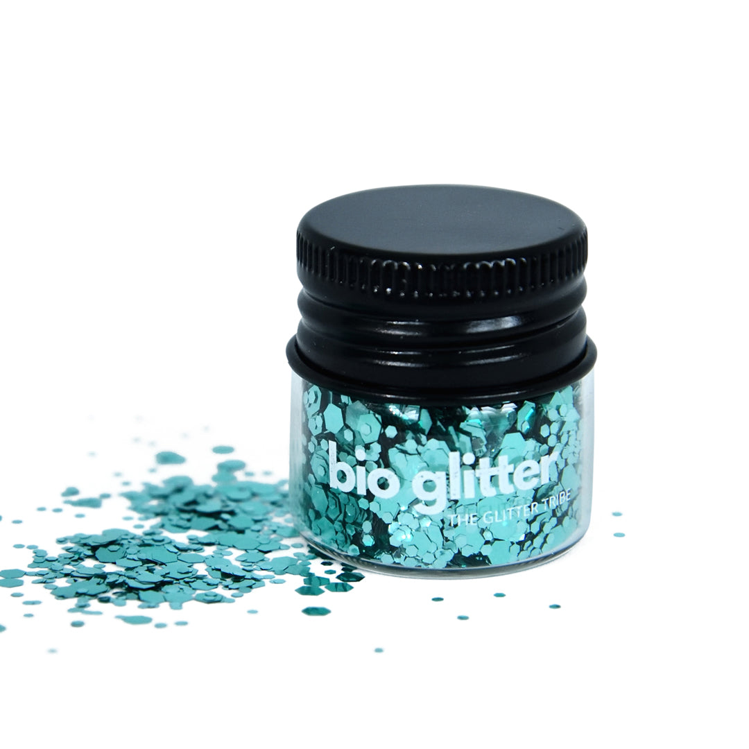 Turquoise blue glitter in a jar with a black lid .