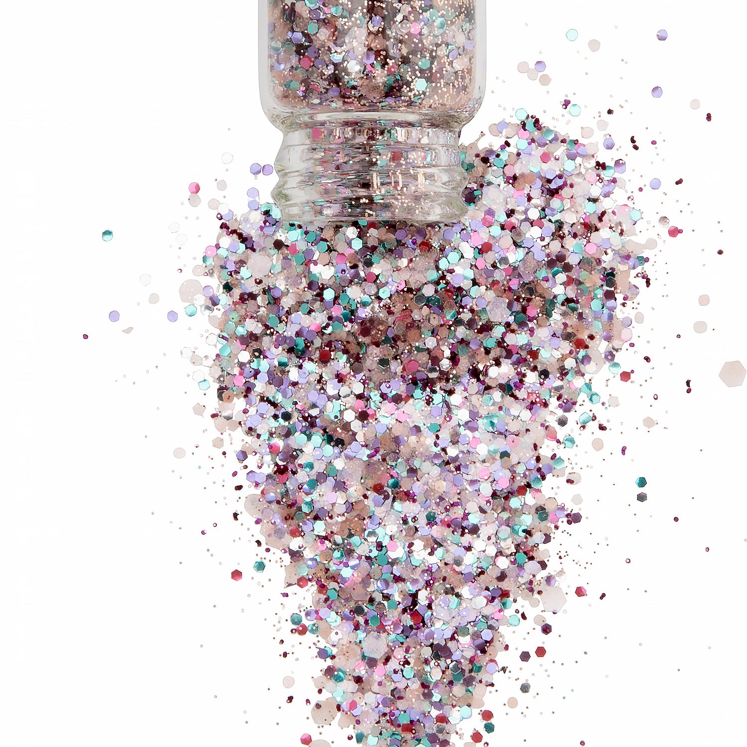 A floral mix of sparkly biodegradable glitter in a glass jar spilling into a white background.