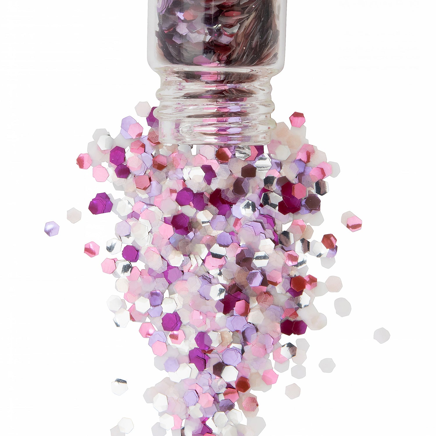 pink glitter in blossom shades in a glass jar spilling over white background.