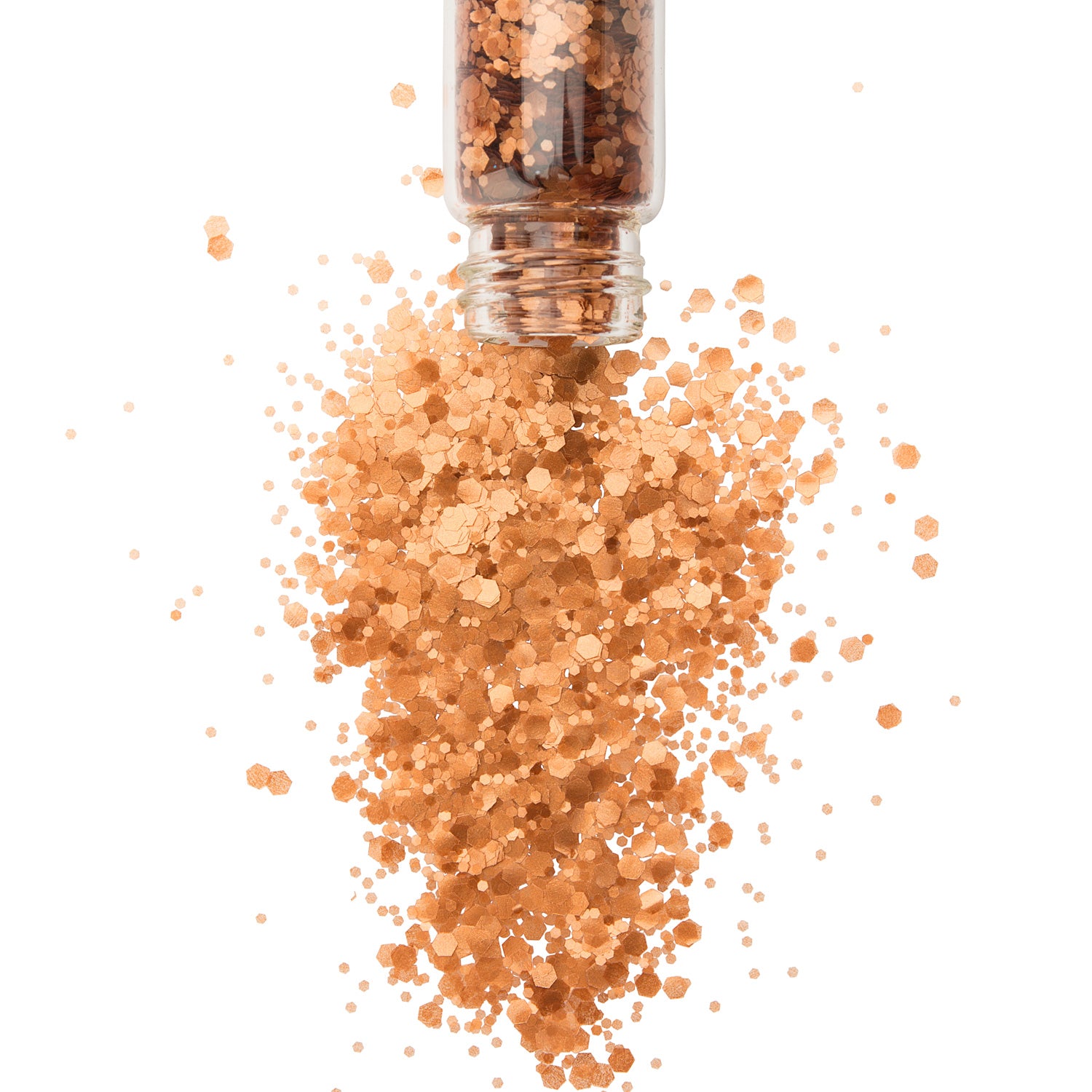 Bronze chunky biodegradable glitter in a glass jar spilling onto a white background,