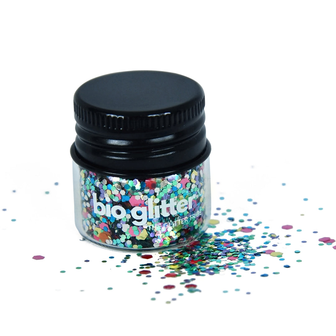 Glitter in a jar that is rainbow coloured with a black lid.