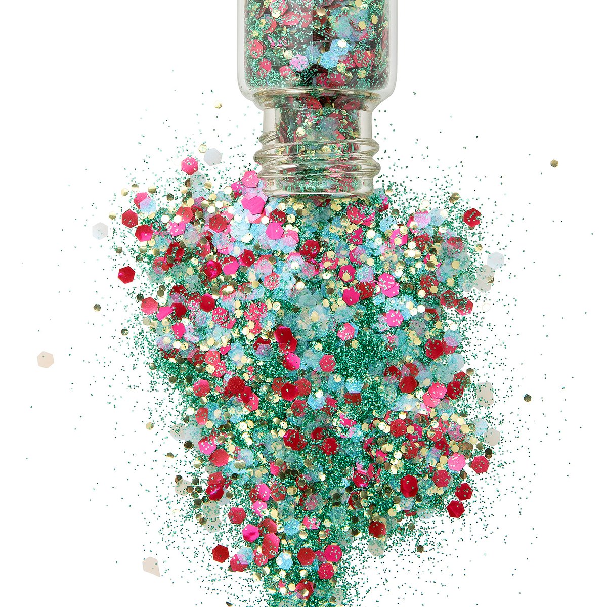 Glitter in Christmas colours spilling out of a glass jar while sparkling 
