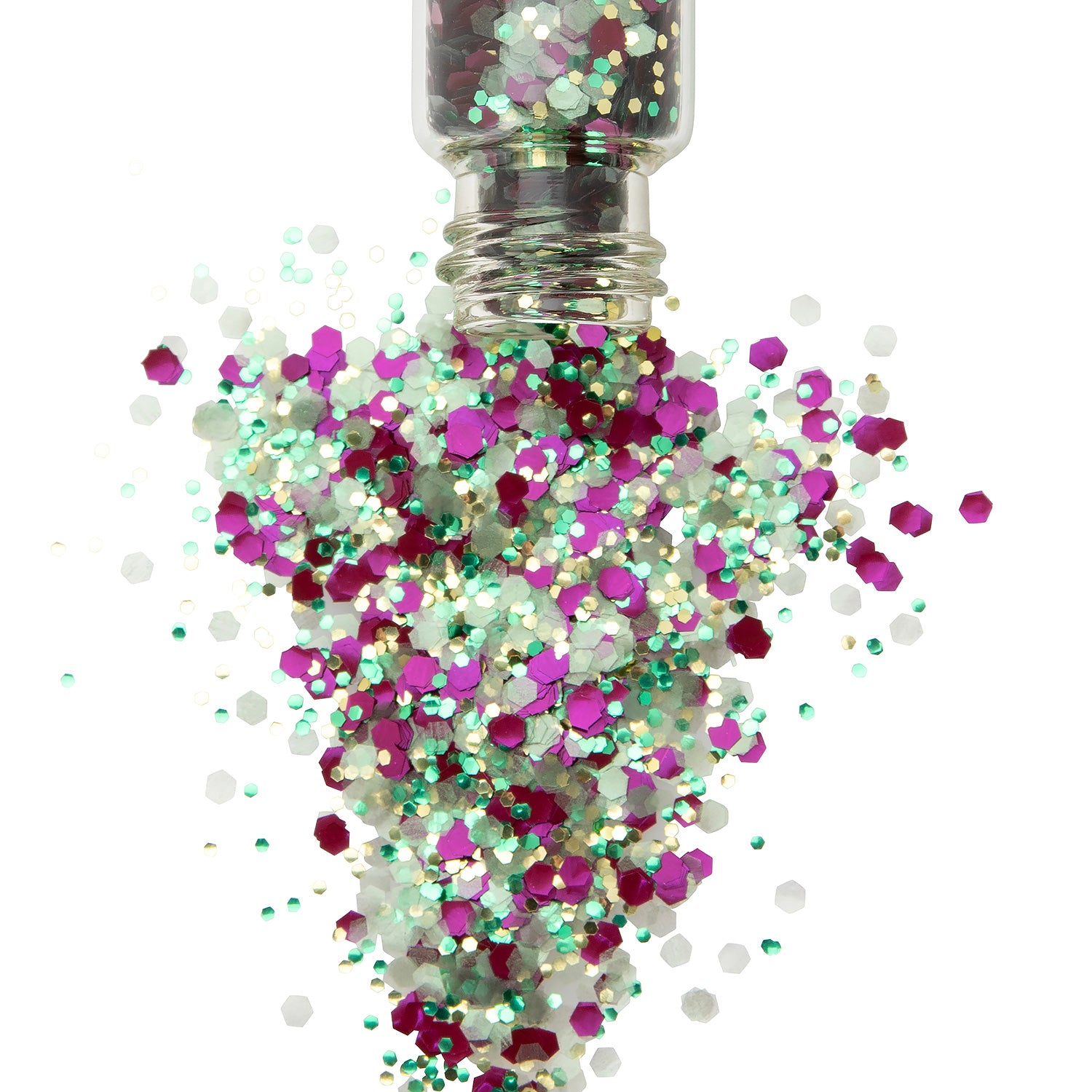 Green gold and purple chunky glitter in a glass jar spilling onto a white backround.