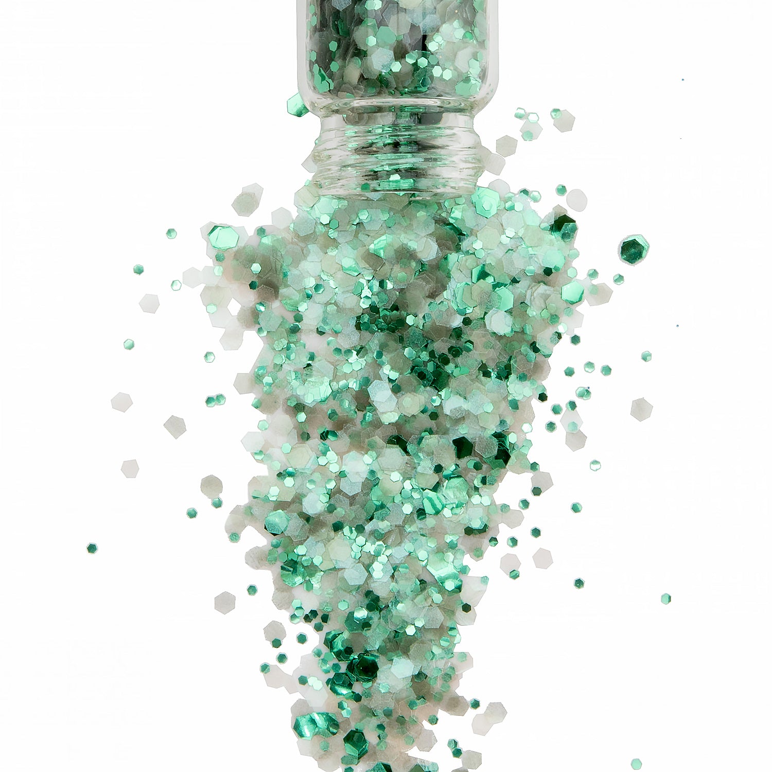 A jar of biodegradable glitter spilling out, with a mix of chunky and fine glitter in shades of green and a touch of opal.