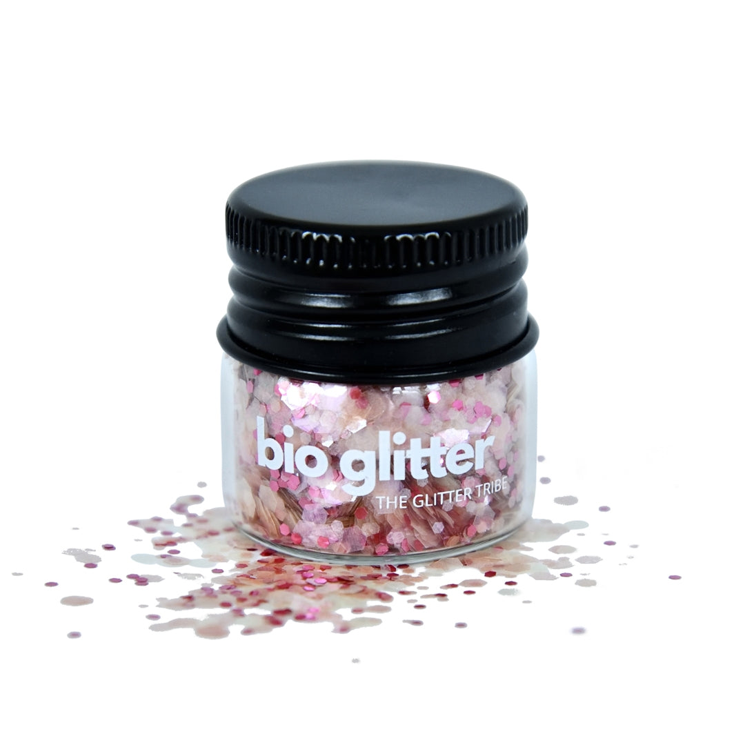 Pink bio glitter in a glass jar with black lid 